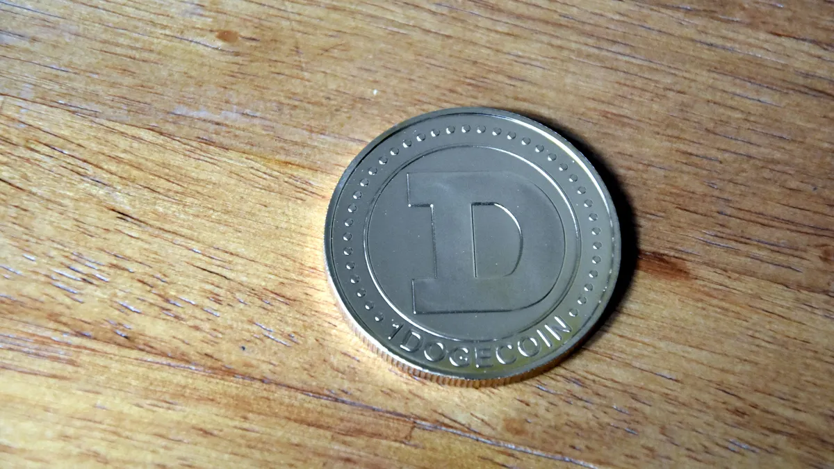 online casino sign up bonus canada real money - physical Dogecoin coin on a wooden table